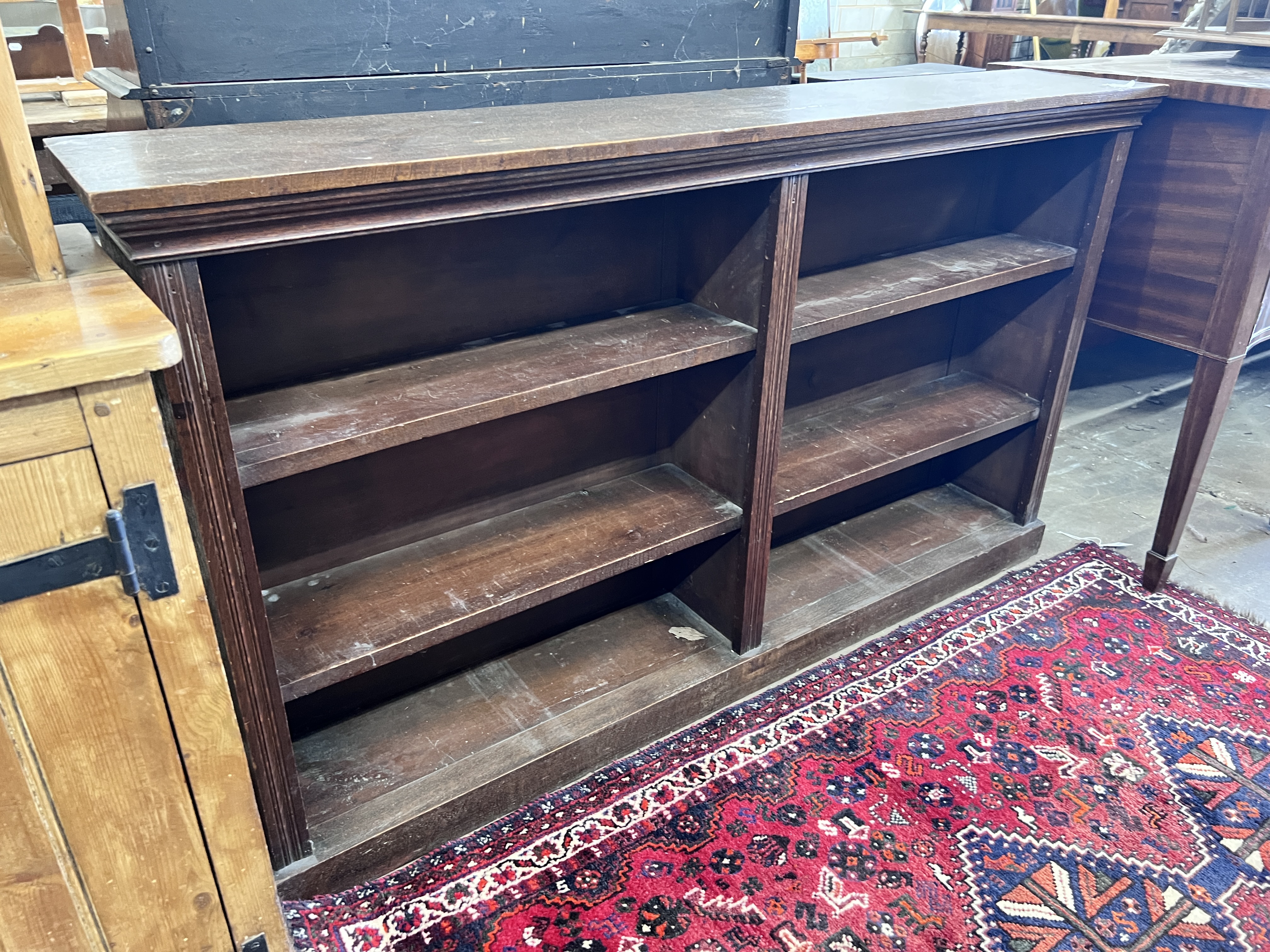 An early 20th century oak open dwarf bookcase, width 160cm, depth 28cm, height 91cm